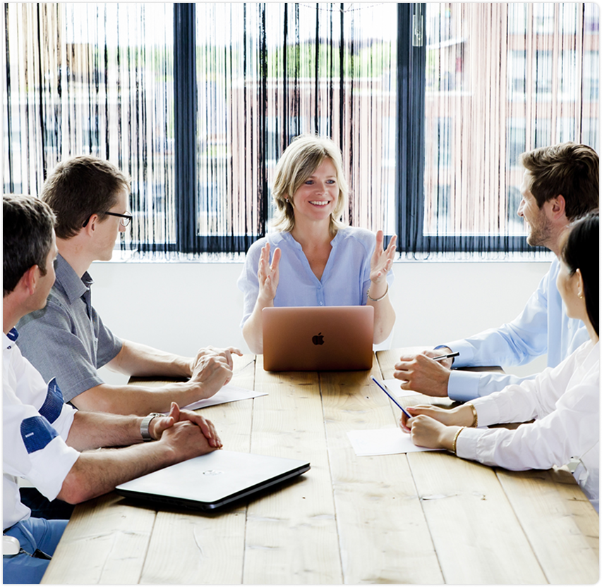 Professional team collaborating around conference table